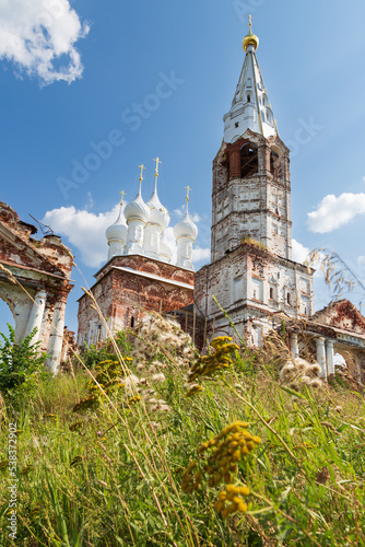 Ruins of a Russian Orthodox Church with a high bell tower in daylight, Dunilovo village, Russia