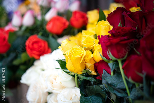 Group of rose flowers petal bouquet which is selling at the flower market  selective focus at the yellow one rose head.