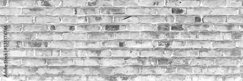 White grunge brick wall background. Gray peeled worn brick wall.