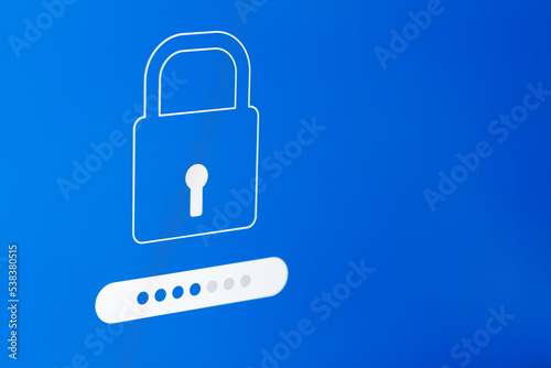 Verification window, password characters in the form of dots. Padlock symbol. Photo of a computer screen, selective focus. Close-up.