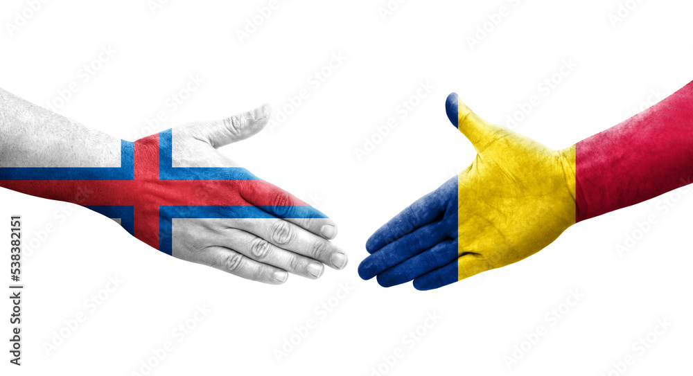 Handshake between Chad and Faroe Islands flags painted on hands, isolated transparent image. Handshake between Chad and Faroe Islands flags painted on hands, isolated transparent image.