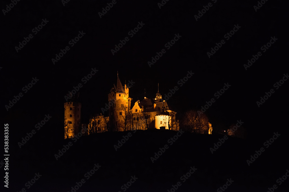 Dubravka castle is away in the night lighting, Teplice, Czech.