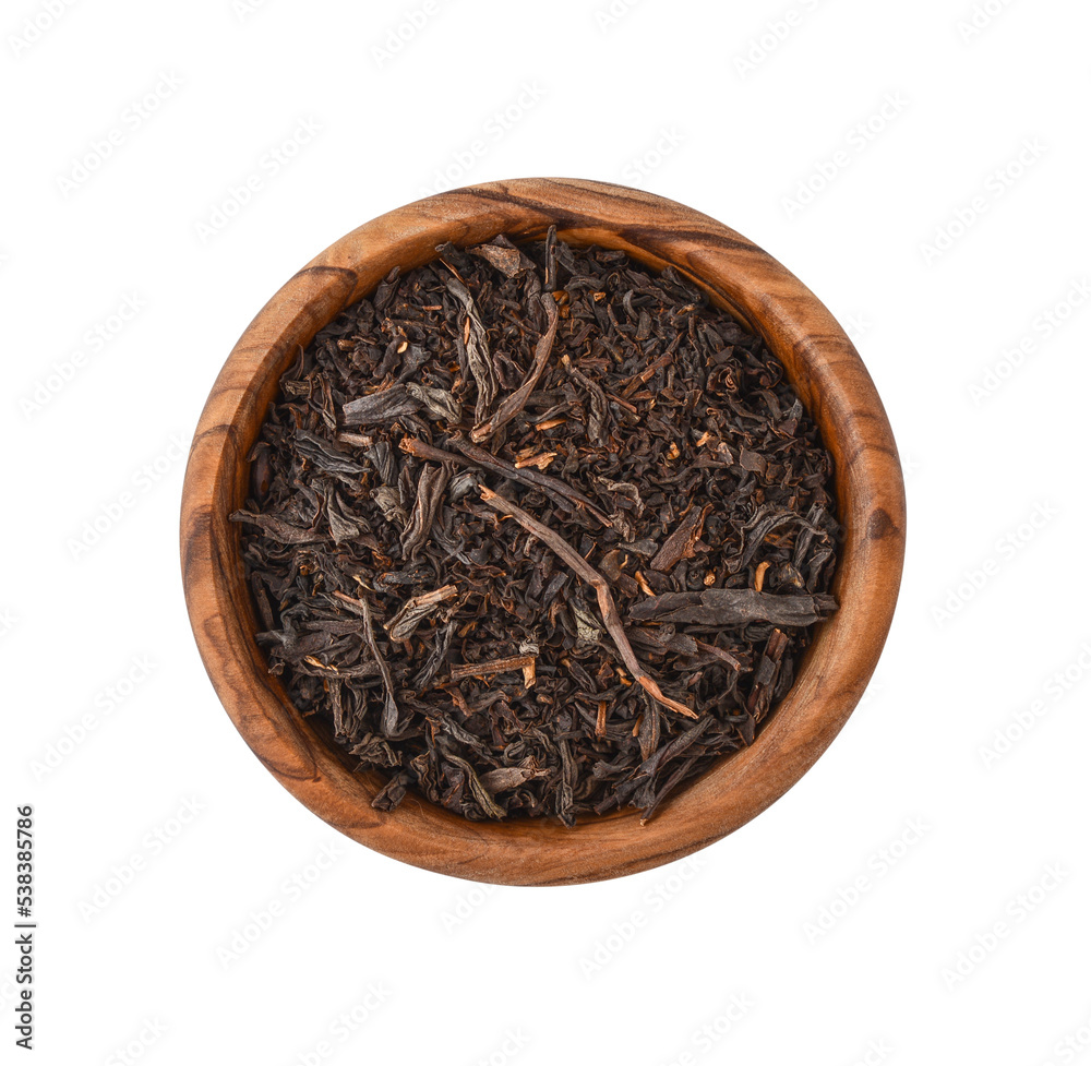 Dry tea leaves in wooden bowl Dry tea leaves in wooden bowl