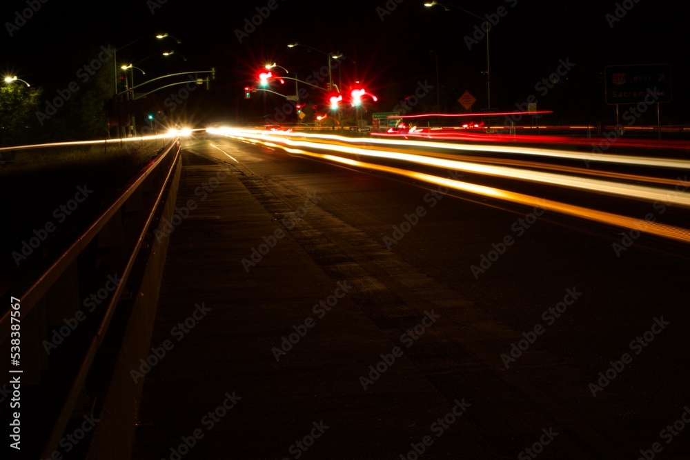 car lights across bridge