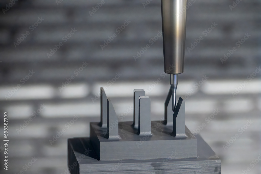 Fotografie The CNC milling machine cutting the graphite electrode parts with solid ball end mill