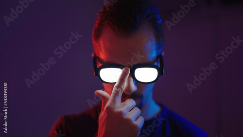 Photos Portrait of man put up glowing glasses like an anime protagonist villain
