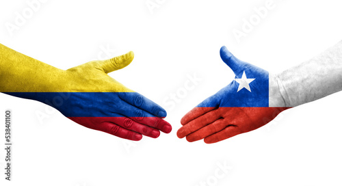 Handshake between Chile and Colombia flags painted on hands, isolated transparent image.