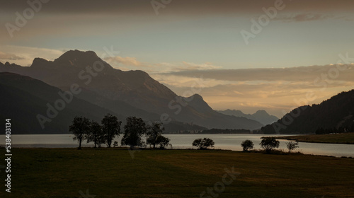 Peaceful evening at the lake in Graubünden Switzerland, with views on the mountains