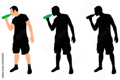 Casual young man drinking bottle of beer