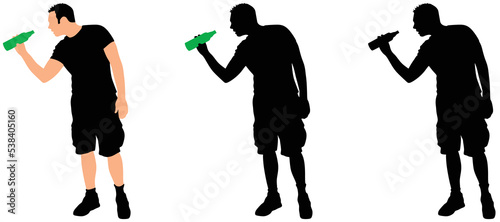 Casual young man drinking bottle of beer