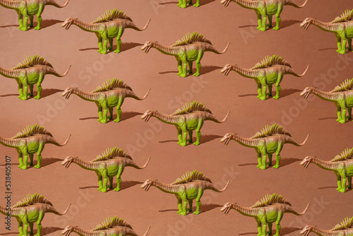 Brown green spiny dinosaur on a dirty brown background. Pattern. Minimal design. © Lazarevic Photoworks