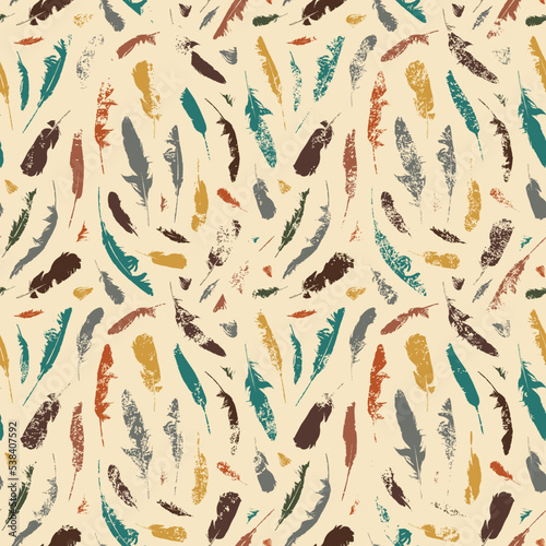 Grunge seamless pattern with colored disheveled feathers on a beige backdrop. Vector repeating background with chaotic scattered bird plumelets in boho style. Wallpaper, wrapping paper, fabric design
