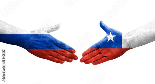 Handshake between Chile and Russia flags painted on hands, isolated transparent image.