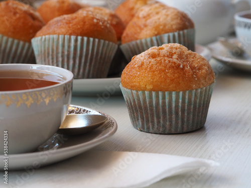 Сarrot muffins on a plate and cup of tea