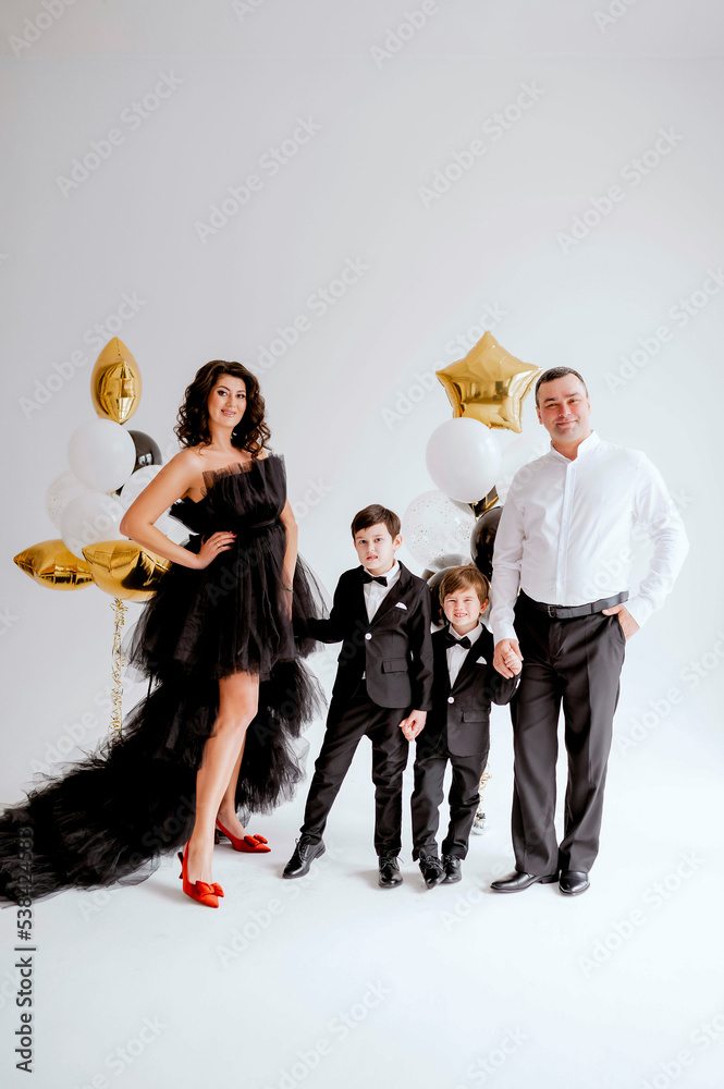 Family at black dress code at party Family at black dress code at party