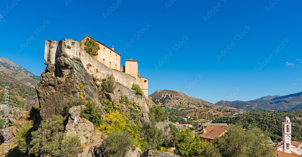 Corte, a beautiful city in the mountains on the island of Corsica, a view of the city and the mountains