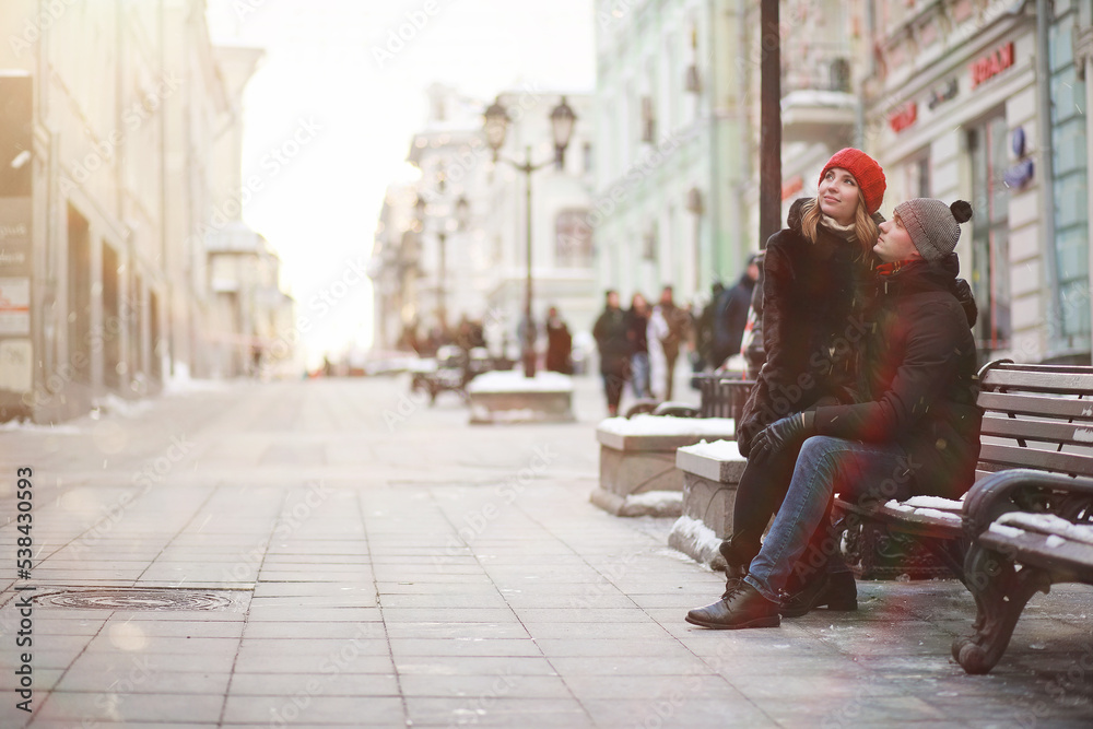 Young couple walking through the winter Young couple walking through the winter
