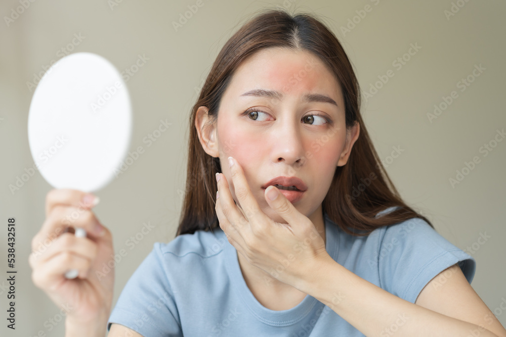 Dermatology, scratch asian young woman looking at mirror, expression