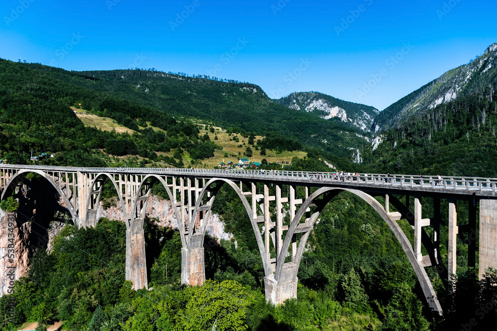 Durdevica bridge through the Tara river canyon. Durmitor National Park. Montenegro. Durdevica bridge through the Tara river canyon. Durmitor National Park. Montenegro.