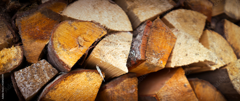 Fototapeta premium Background with old wooden boards, harvested firewood.