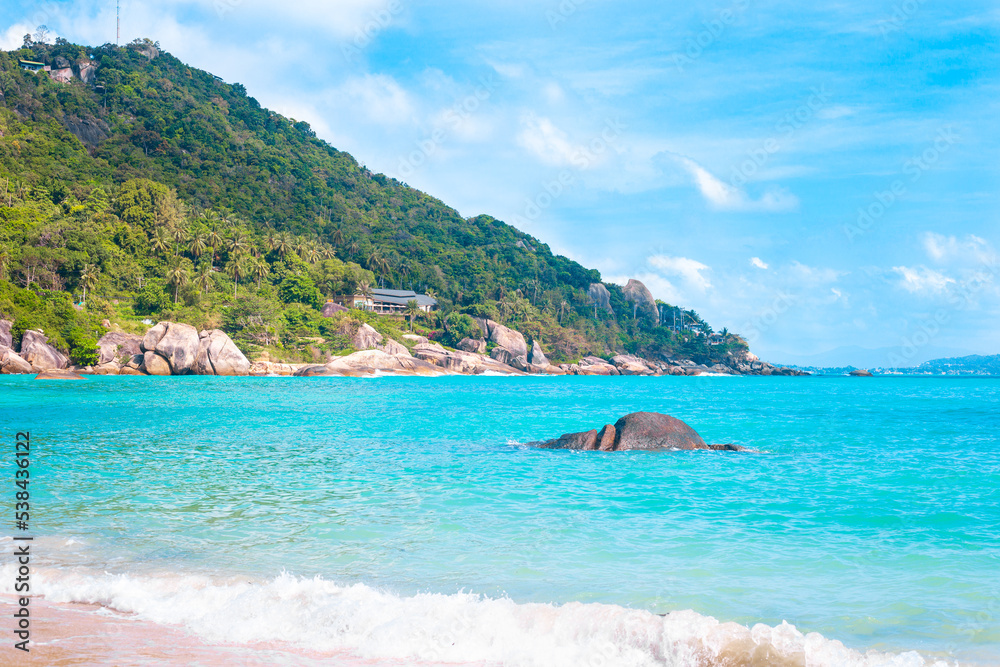 Tropical seascape. Blue sea and mountains on a sunny day on a tropical island in Thailand. Travel and tourism Tropical seascape. Blue sea and mountains on a sunny day on a tropical island in Thailand. Travel and tourism