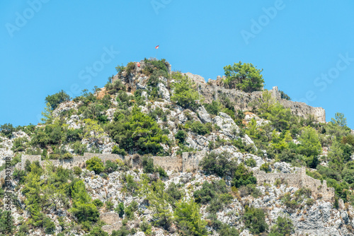 Ruins of Alara Castle sitting on a massive rocky hill in Alanya, Turkey. photo