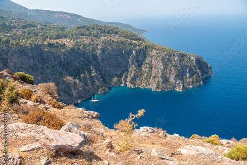 Fototapeta Naklejka Na Ścianę i Meble -  Mountainous Mediterranean coastline in Butterfly Valley area of Oludeniz beach resort in Mugla province of Turkey.