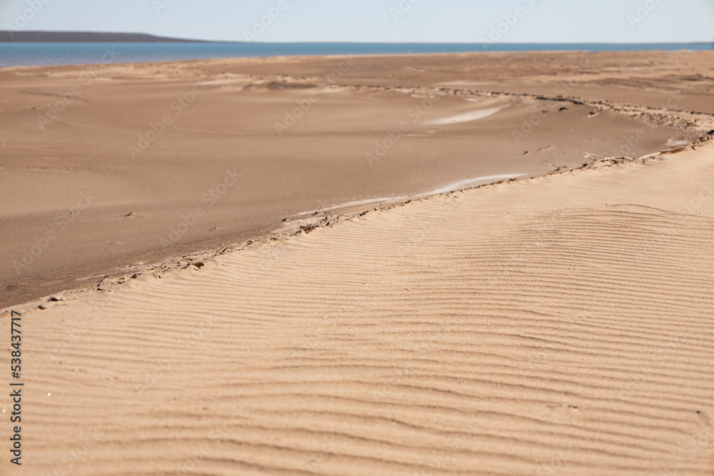 Ripples in the sand made by the wind. Ripples in the sand made by the wind.