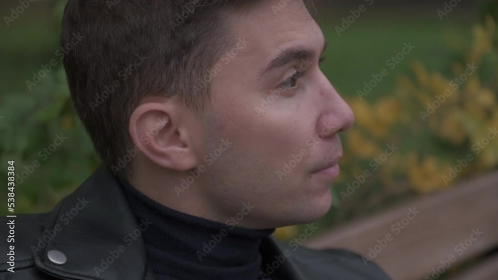Close-up of a man in a black bow