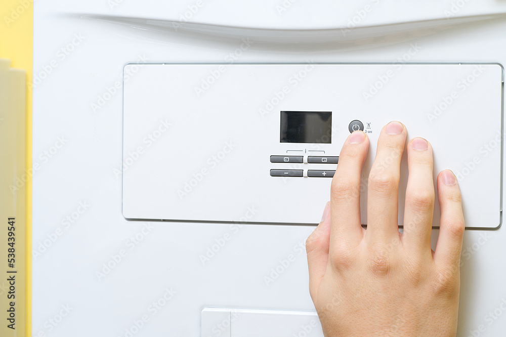 Setting up and servicing by a service department. Adjustment of gas boiler at domestic home. home repairs service concept. Setting up and servicing by a service department. Adjustment of gas boiler at domestic home. home repairs service concept.