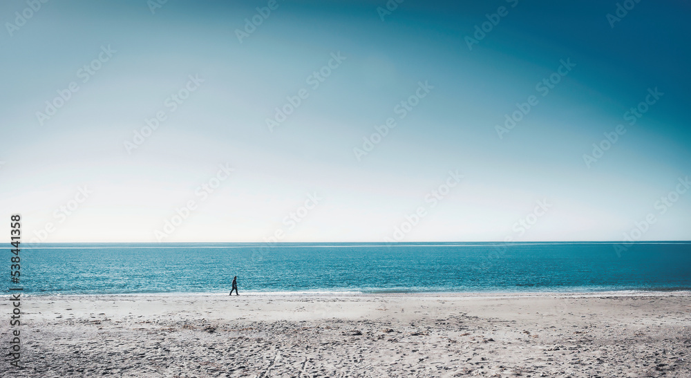 A walk on the lonely beach. Relaxation, meditation, leisure. A walk on the lonely beach. Relaxation, meditation, leisure.