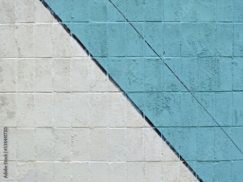 Colorful painted tile wall (blue, white and black) as background or texture