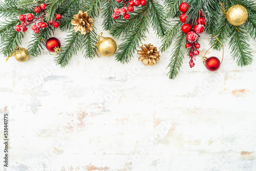 Christmas holiday decorations   christmas background at white. Fir tree  red and golden decor. Flat lay composition.