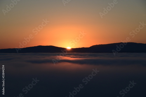 sunset over the clouds