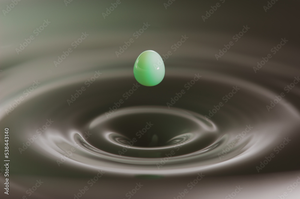 Green liquid droplet renouncing bath of liquid Green liquid droplet renouncing bath of liquid