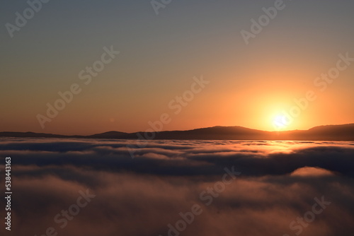 sunset over the clouds © Ryan