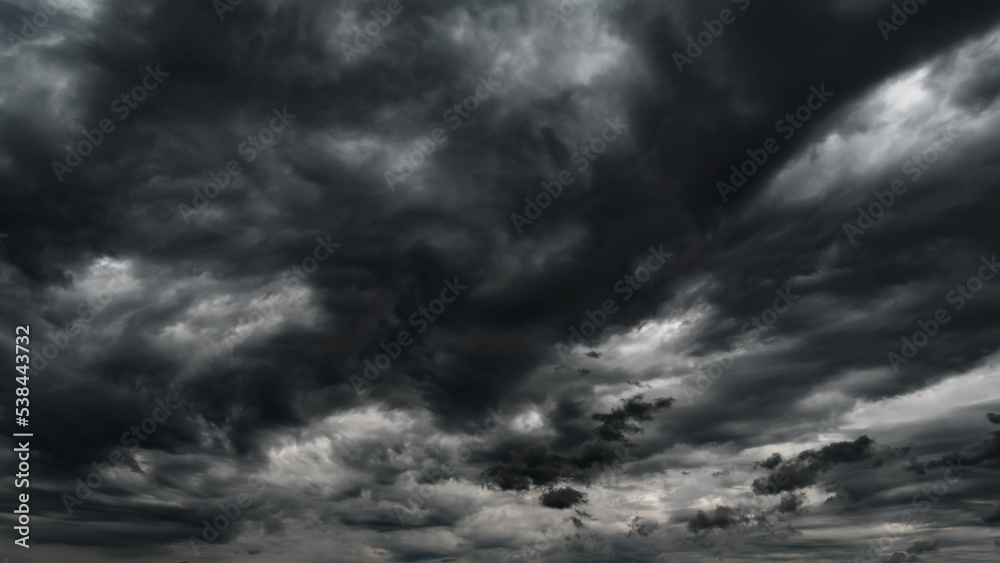 dark dramatic sky with black stormy clouds before rain or snow as ...