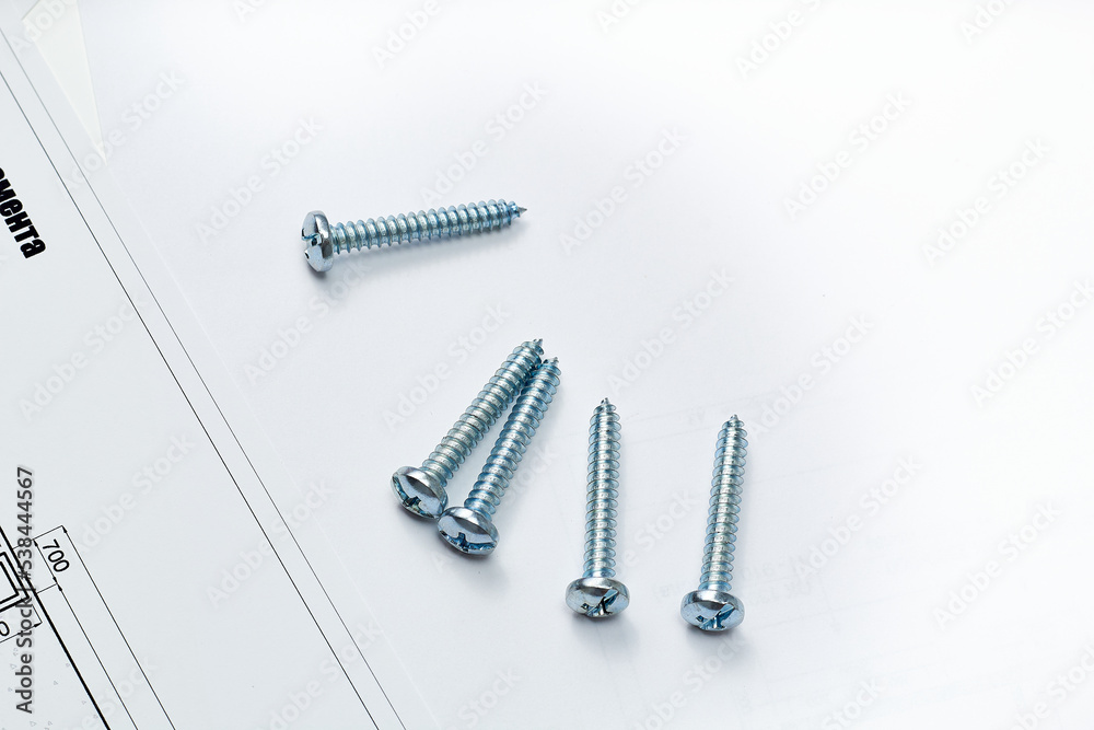 Working tools and drawings of the designer on a white background. Construction of houses, drawing, interior design. Working tools and drawings of the designer on a white background. Construction of houses, drawing, interior design.