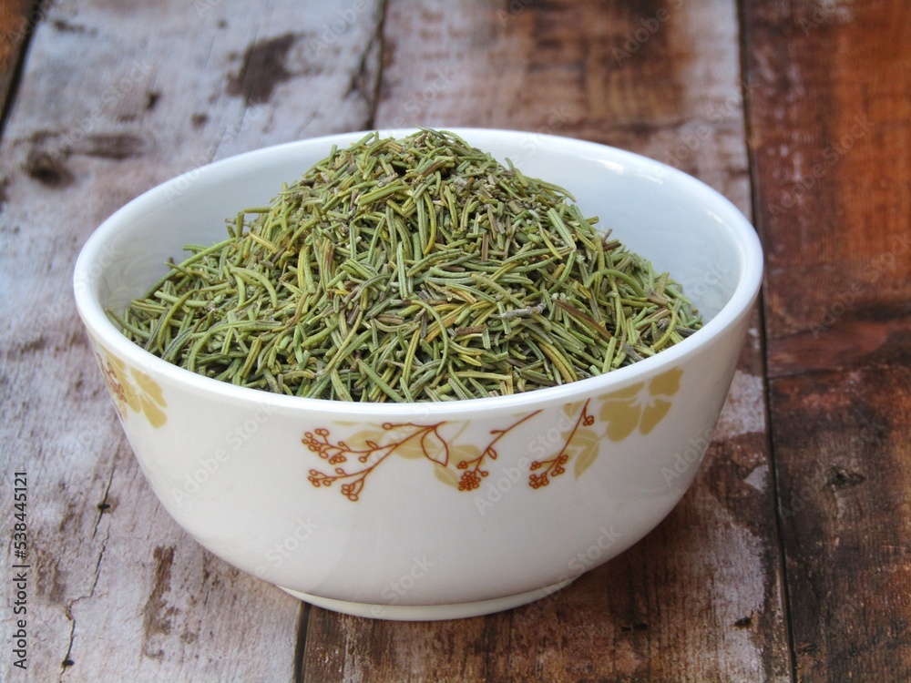 Dried rosemary leaves in a bowl 