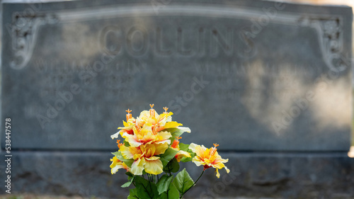Fake Flowers before Tombstone