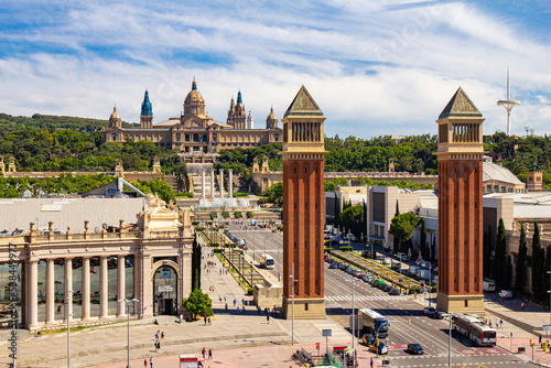 Barcelona, Catalonia, Spain - 26 JUlY 2019: Aerial rooftop view of Placa d'Espanya or Plaza de Espana, Spanish Square and Fountain Of Montjuic in summer sunny day. National Museum of Art on background