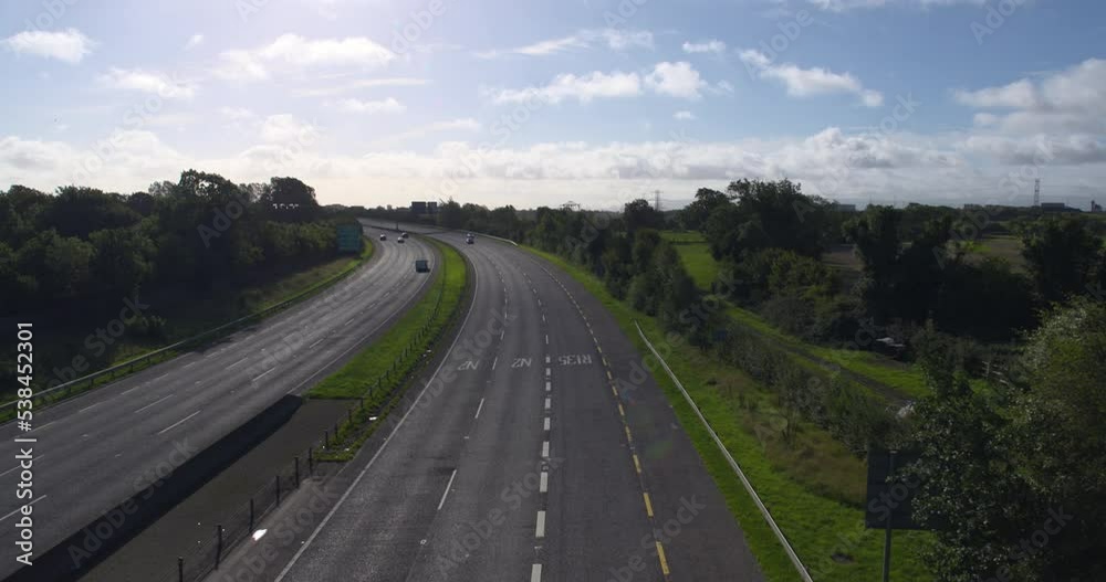Motorway road traffic viewed from bridge overpass Ireland green landscape Motorway road traffic viewed from bridge overpass Ireland green landscape