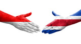 Handshake between Costa Rica and Indonesia flags painted on hands, isolated transparent image.