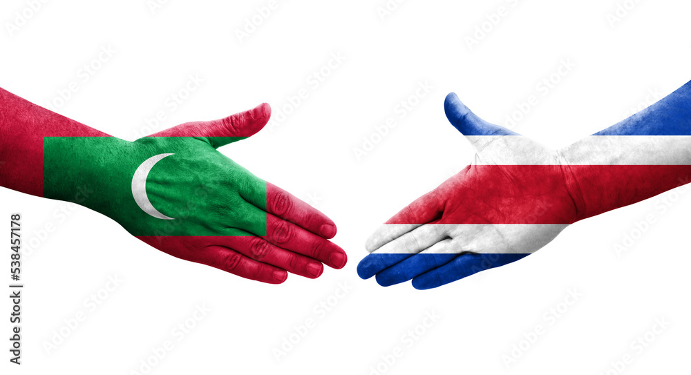 Handshake between Costa Rica and Maldives flags painted on hands, isolated transparent image.
