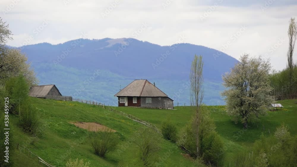 View Of A Wooden House On A Mountain Ridge In The Carpathians View Of A Wooden House On A Mountain Ridge In The Carpathians