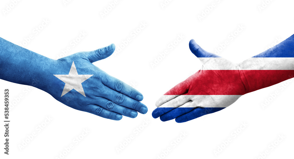 Handshake between Costa Rica and Somalia flags painted on hands, isolated transparent image.