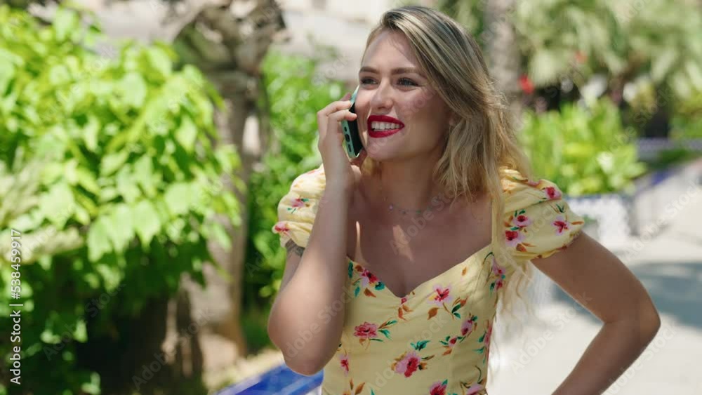 Young beautiful hispanic woman smiling confident talking on the smartphone at park Young beautiful hispanic woman smiling confident talking on the smartphone at park