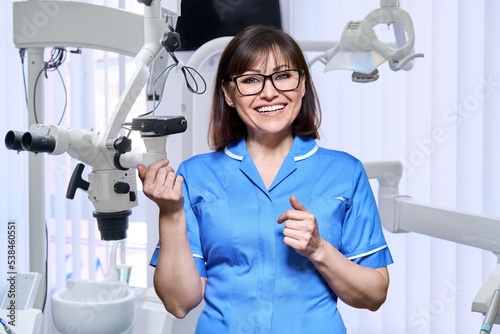Portrait of smiling nurse looking at camera in dentistry