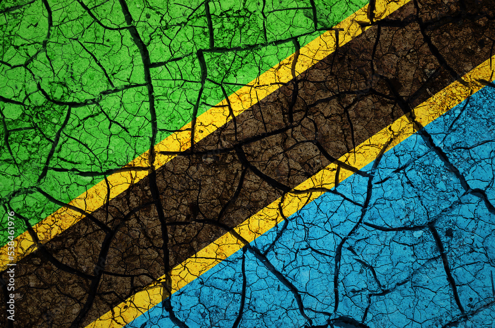 Dry soil pattern on the flag of Tanzania. Country with drought concept. Water problem. Dry cracked earth country. Dry soil pattern on the flag of Tanzania. Country with drought concept. Water problem. Dry cracked earth country.