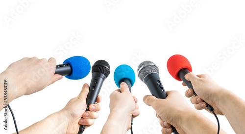 Many journalists holding microphones during interview. Isolated on white background.